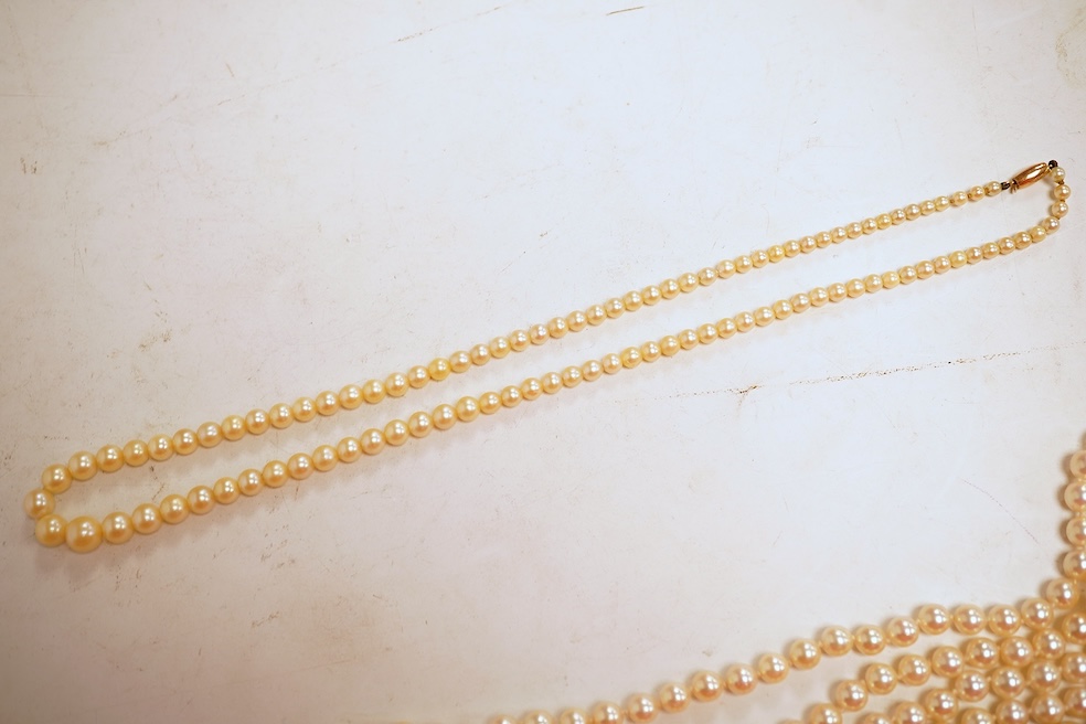 Two cultured pearl necklaces, each composed of a single row of cultured pearls, one with pearls 3-7mm diameter, length 44cm, clasp stamped 9CT; the other with pearls approximately 6mm diameter, length 86cm, clasp with Br